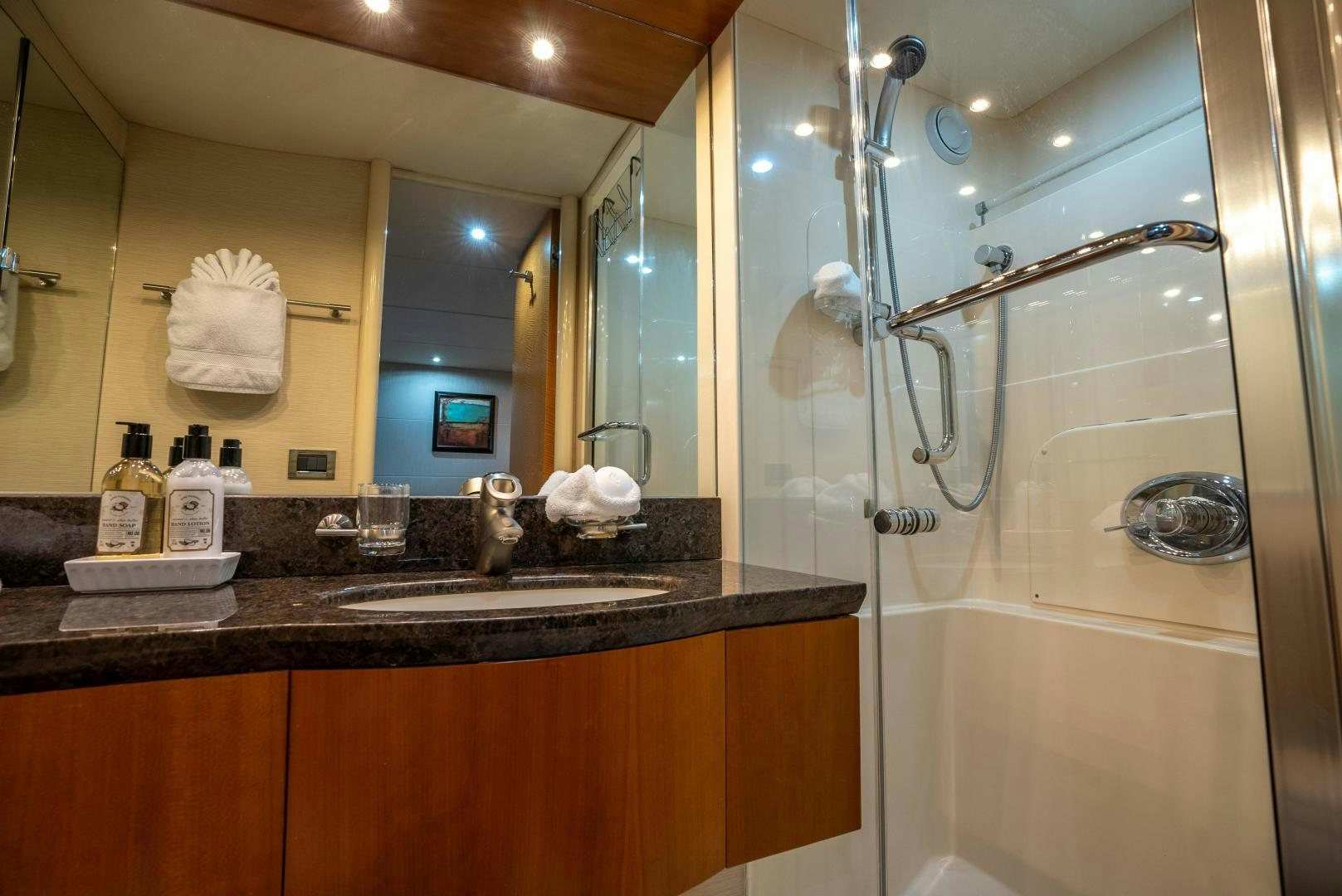a bathroom with a glass shower aboard STARFIRE Yacht for Sale