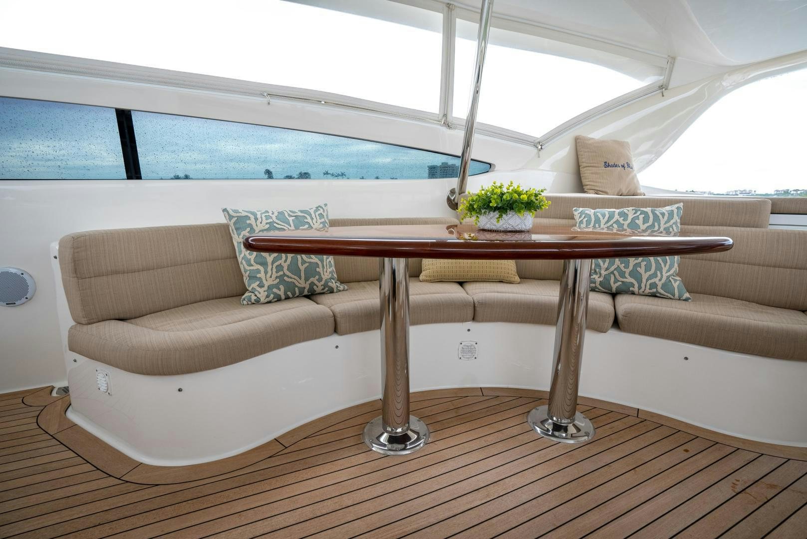 a couch and table in a room aboard STARFIRE Yacht for Sale