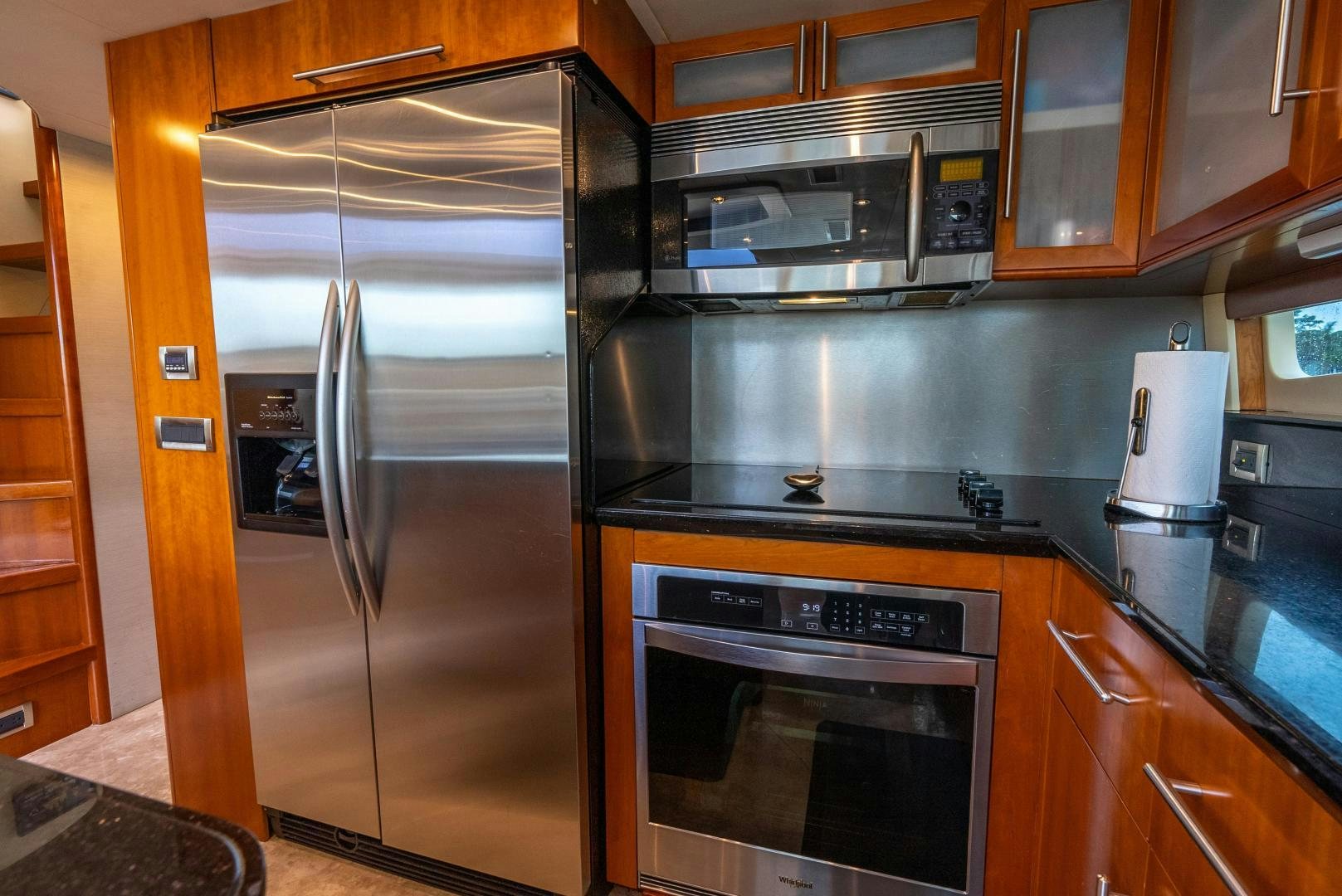 a kitchen with stainless steel appliances aboard STARFIRE Yacht for Sale