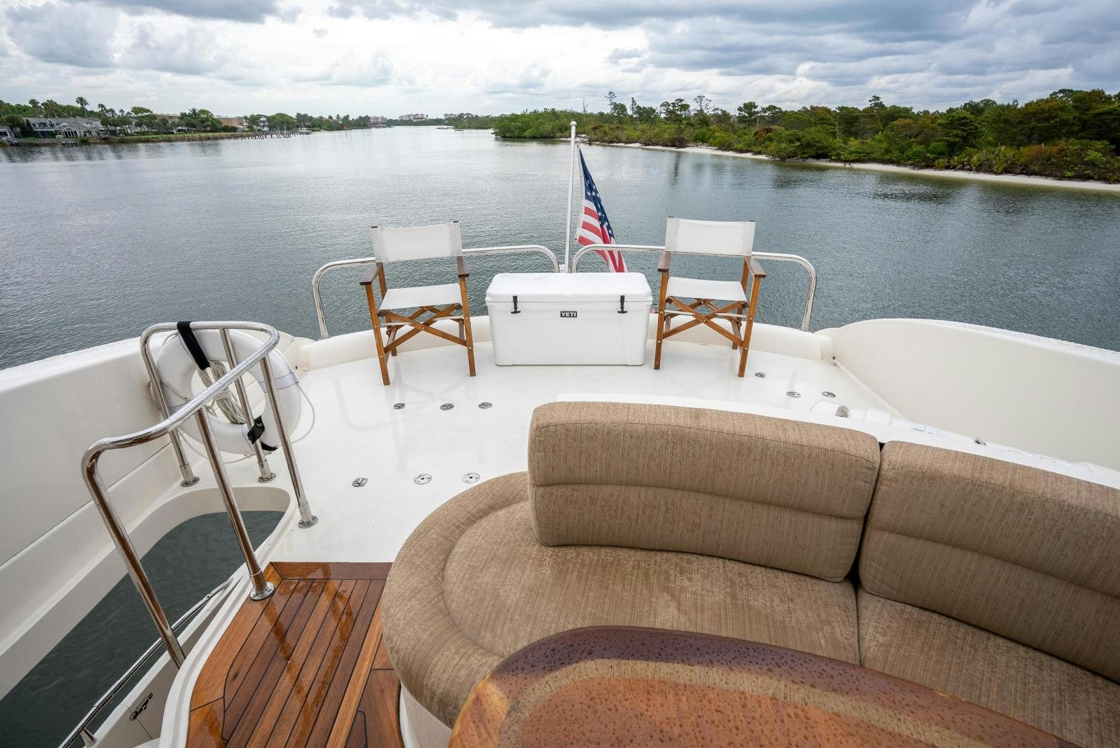 a boat with chairs on it aboard STARFIRE Yacht for Sale