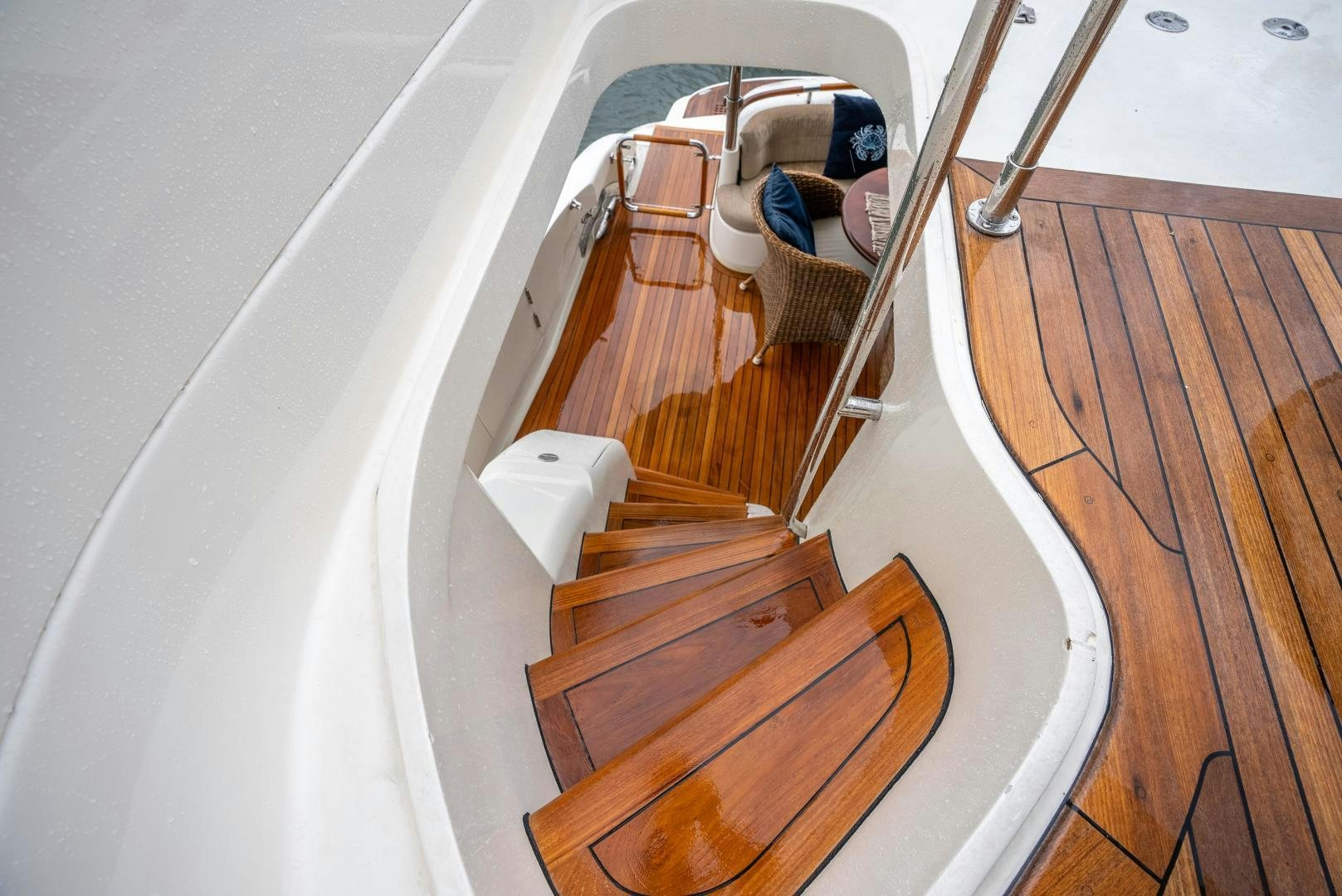 a wooden staircase with a white toilet aboard STARFIRE Yacht for Sale