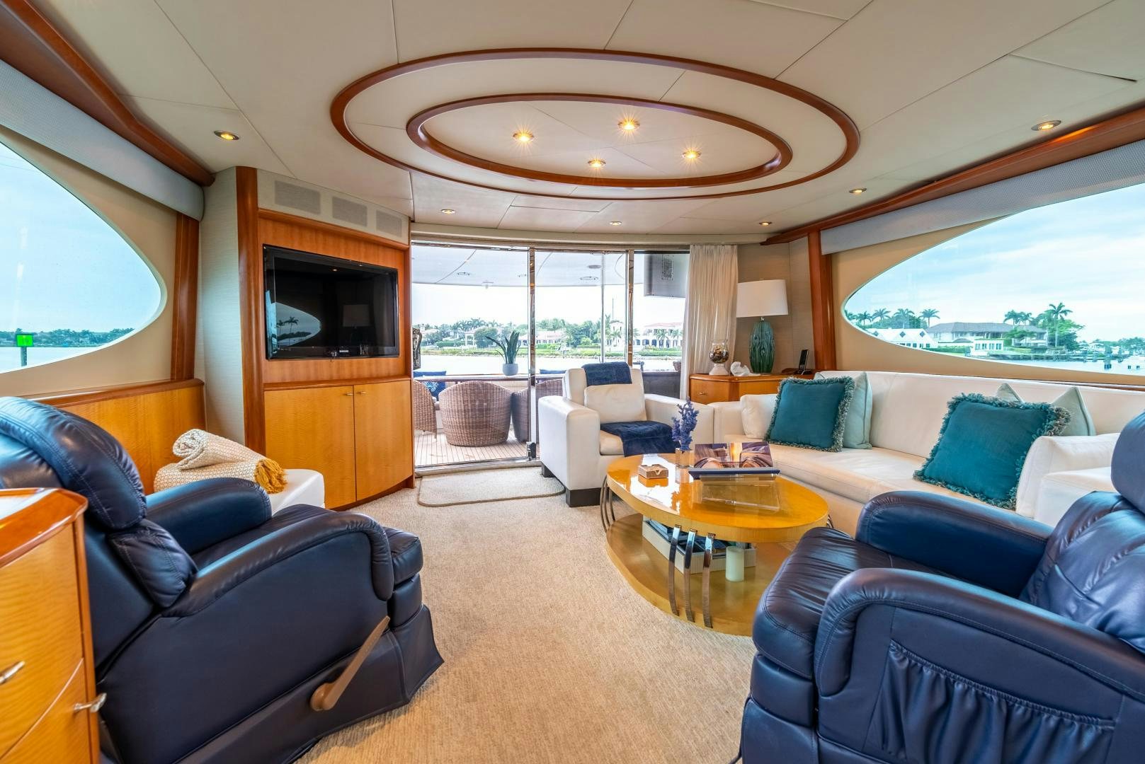 a living room with a large window aboard STARFIRE Yacht for Sale