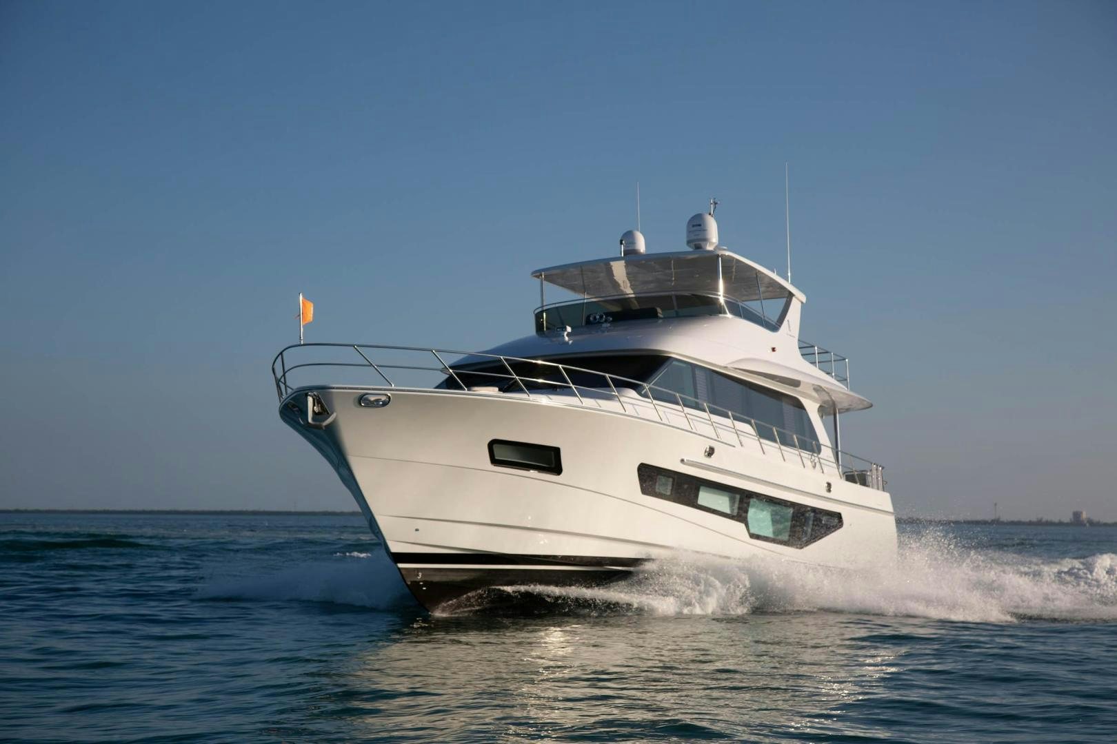 a white yacht on the water aboard ABSOLUTELY Yacht for Sale