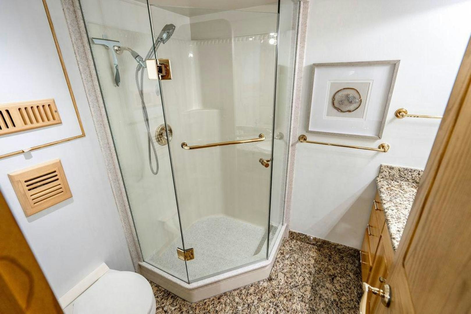 a bathroom with a glass shower aboard THREE BLESSINGS Yacht for Sale