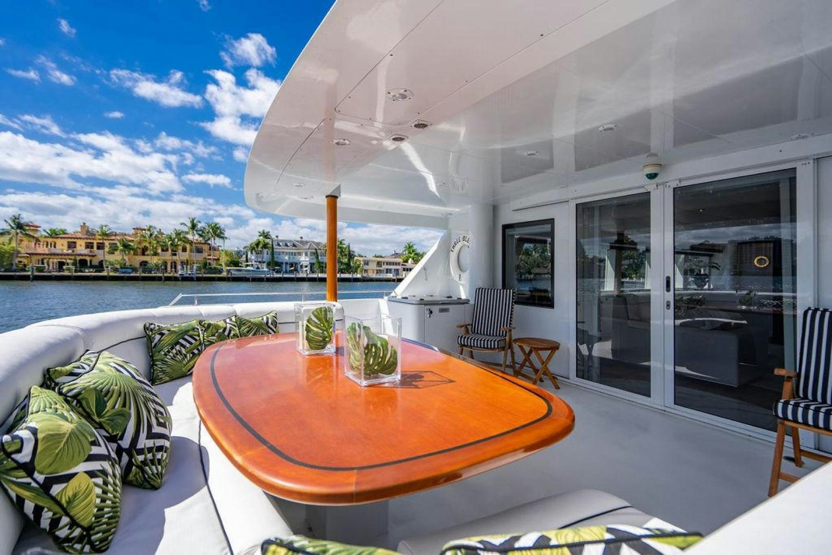 a table and chairs on a patio aboard THREE BLESSINGS Yacht for Sale
