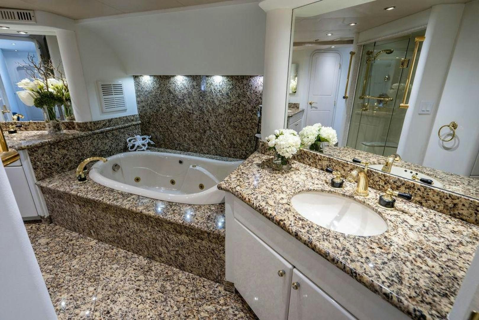 a bathroom with marble counter tops aboard THREE BLESSINGS Yacht for Sale