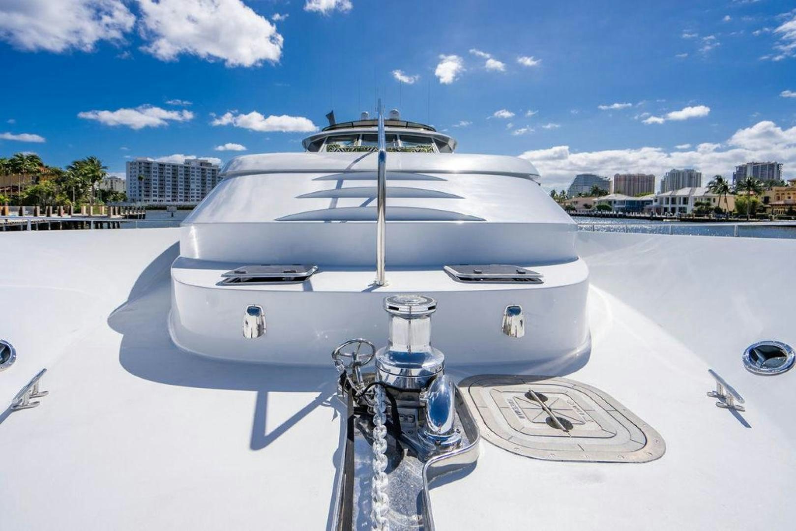 a white boat on a dock aboard THREE BLESSINGS Yacht for Sale