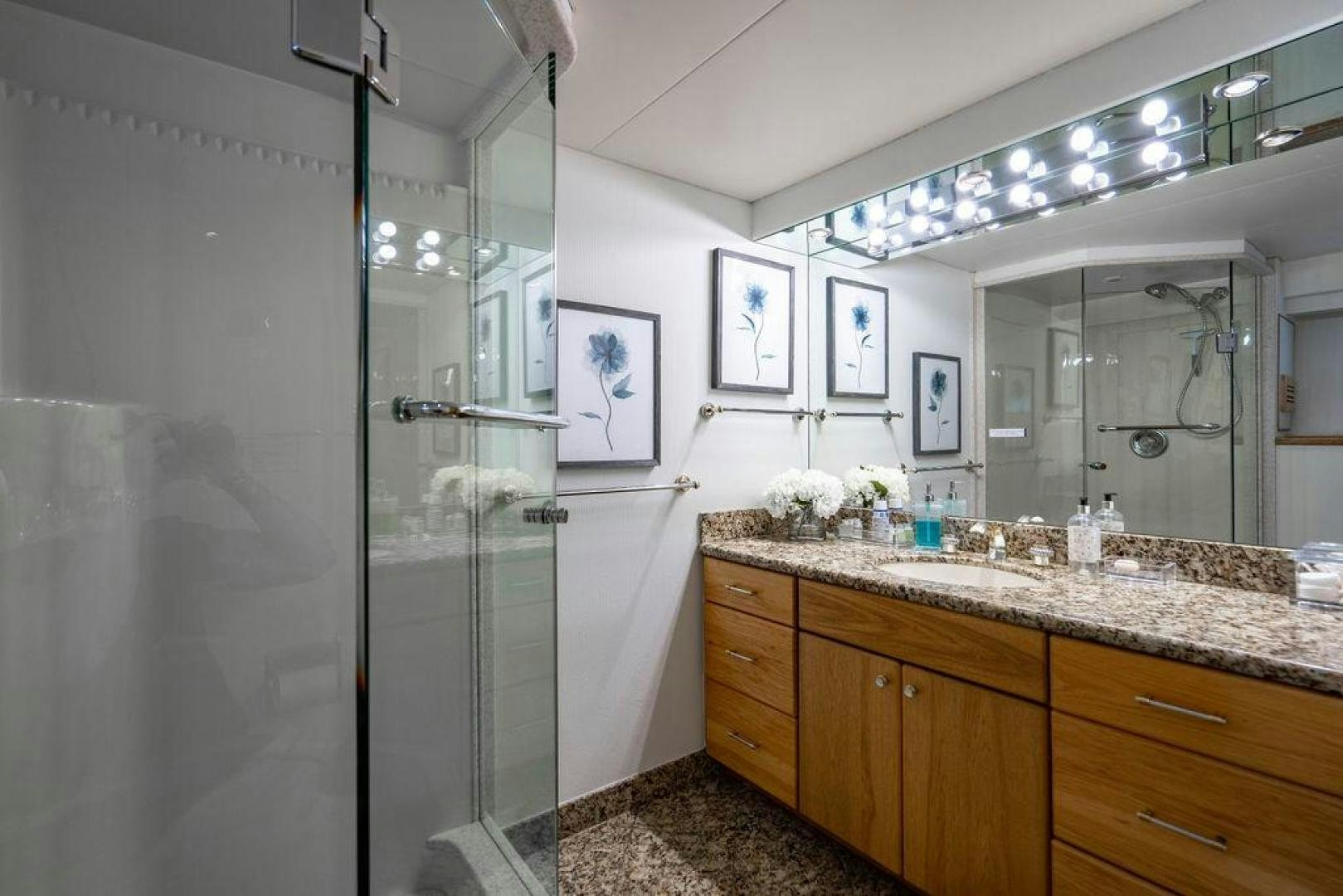 a bathroom with a glass shower aboard THREE BLESSINGS Yacht for Sale