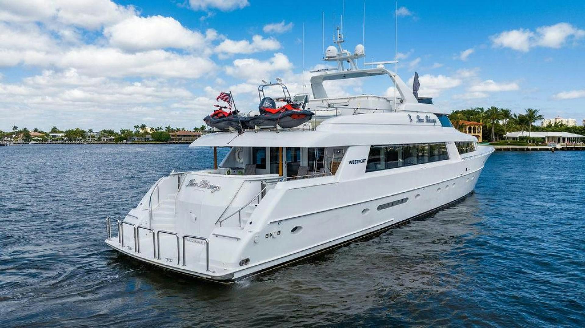 a white boat on the water aboard THREE BLESSINGS Yacht for Sale