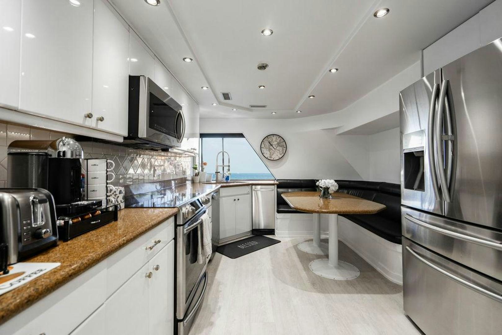 a kitchen with a stainless steel refrigerator aboard THREE BLESSINGS Yacht for Sale