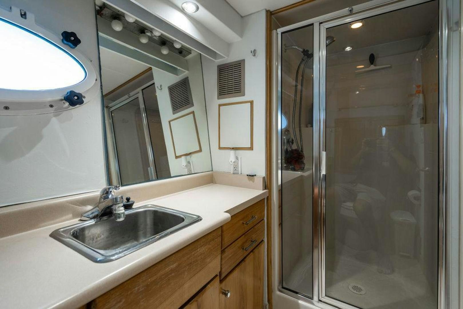 a bathroom with a sink and a mirror aboard THREE BLESSINGS Yacht for Sale