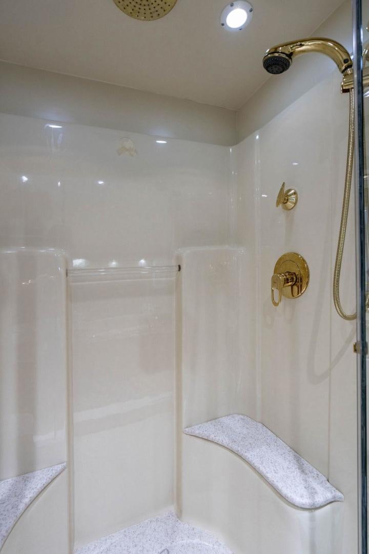 a shower with a towel from the ceiling aboard THREE BLESSINGS Yacht for Sale