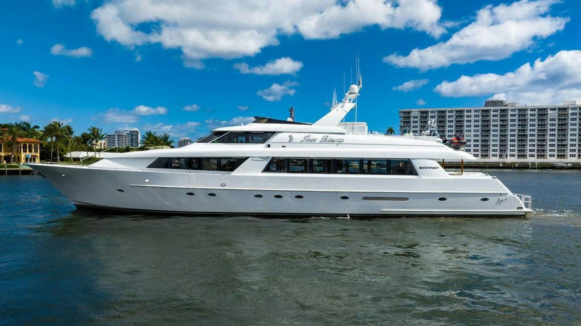 a white yacht in the water aboard THREE BLESSINGS Yacht for Sale