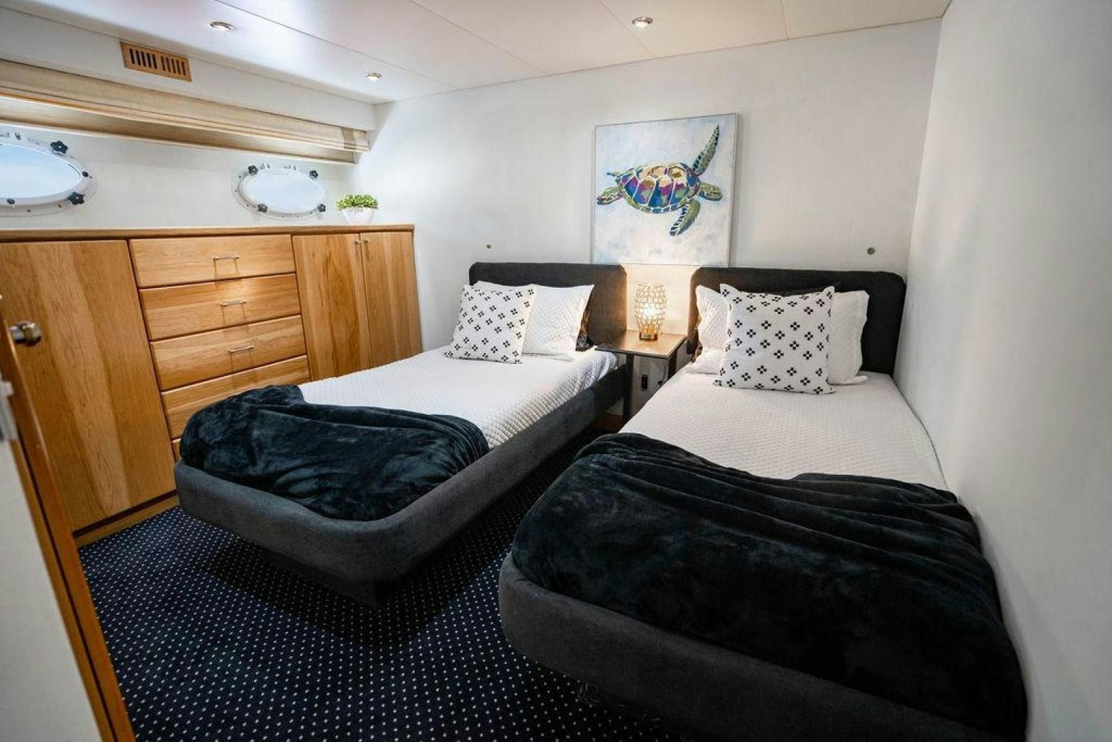 a couple of beds in a hotel room aboard THREE BLESSINGS Yacht for Sale