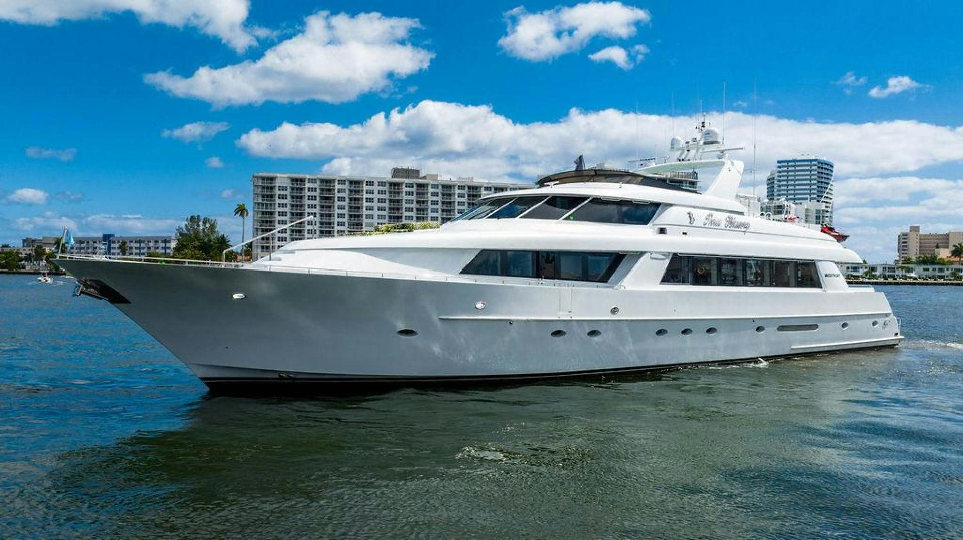 a white yacht in the water aboard THREE BLESSINGS Yacht for Sale