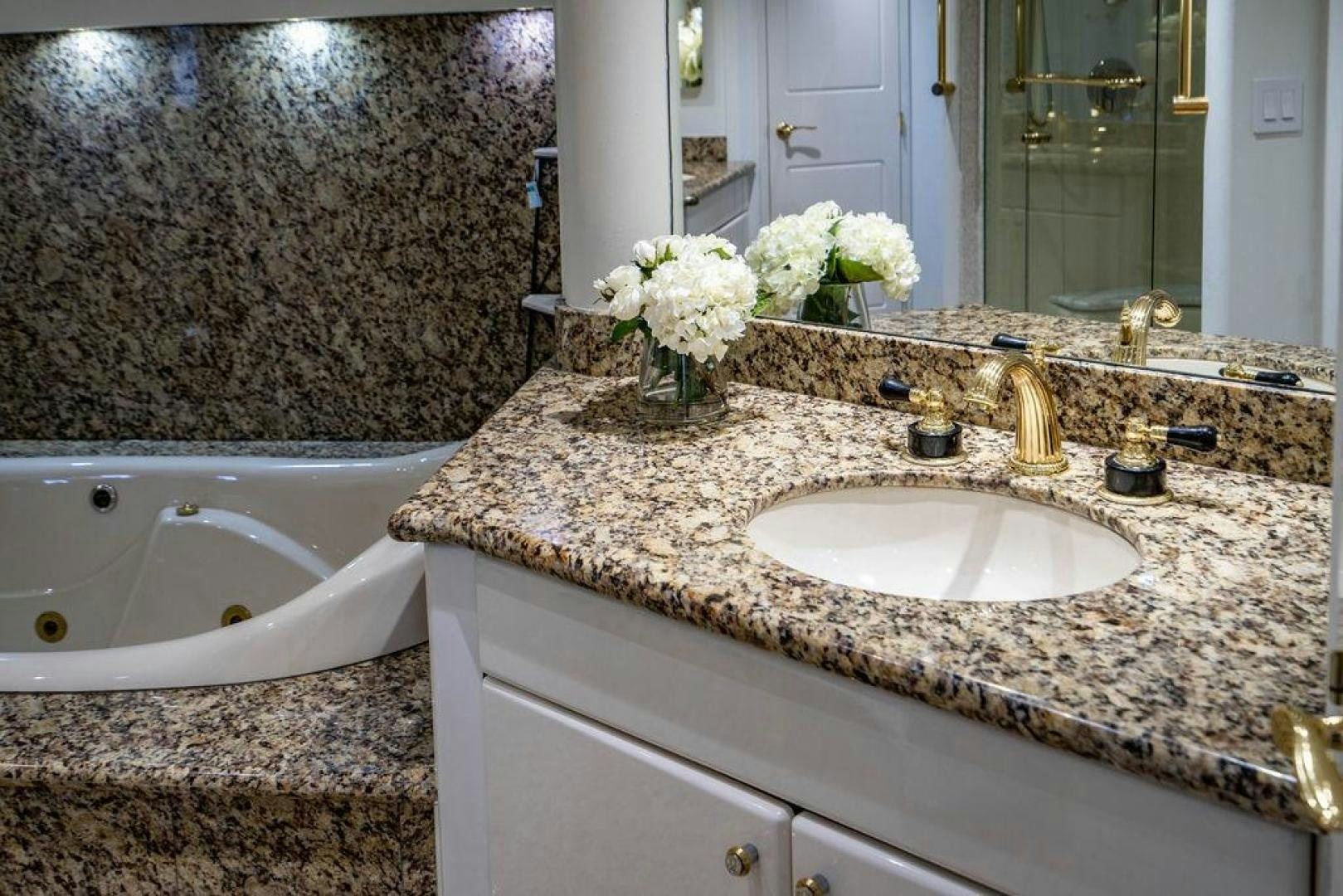 a bathroom with a marble countertop aboard THREE BLESSINGS Yacht for Sale