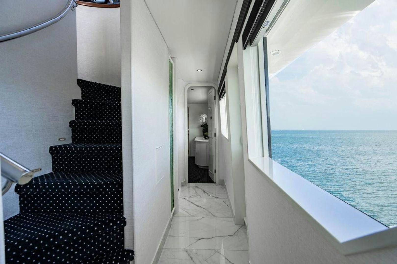 a long hallway leading to a beach aboard THREE BLESSINGS Yacht for Sale