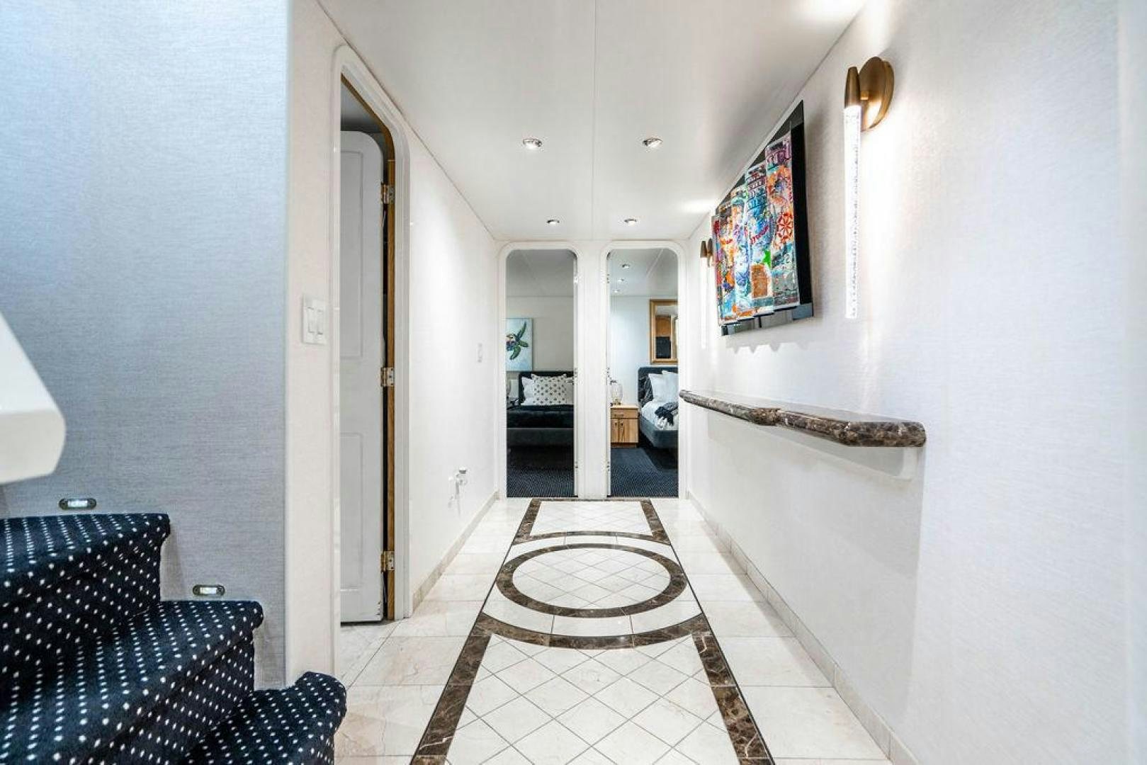 a hallway with a tile floor aboard THREE BLESSINGS Yacht for Sale
