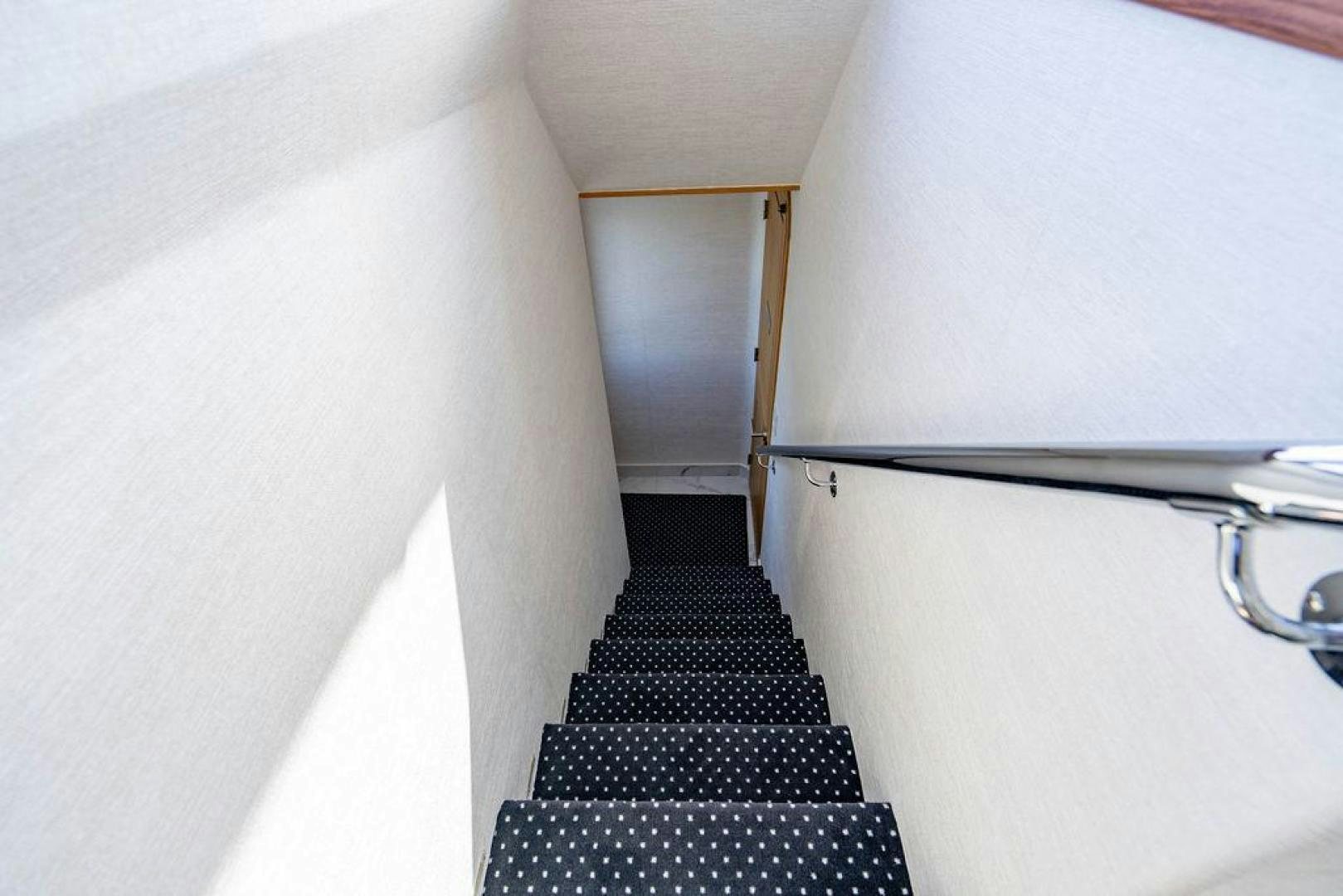 a black and white hallway aboard THREE BLESSINGS Yacht for Sale
