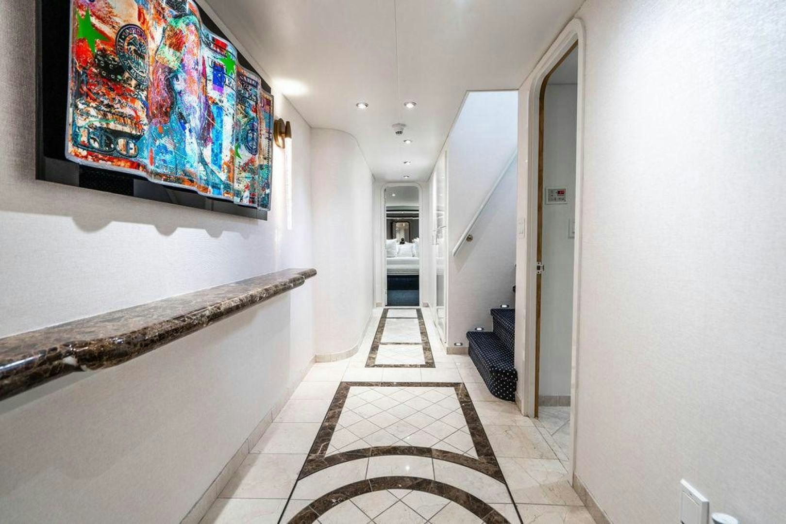 a hallway with a rug aboard THREE BLESSINGS Yacht for Sale
