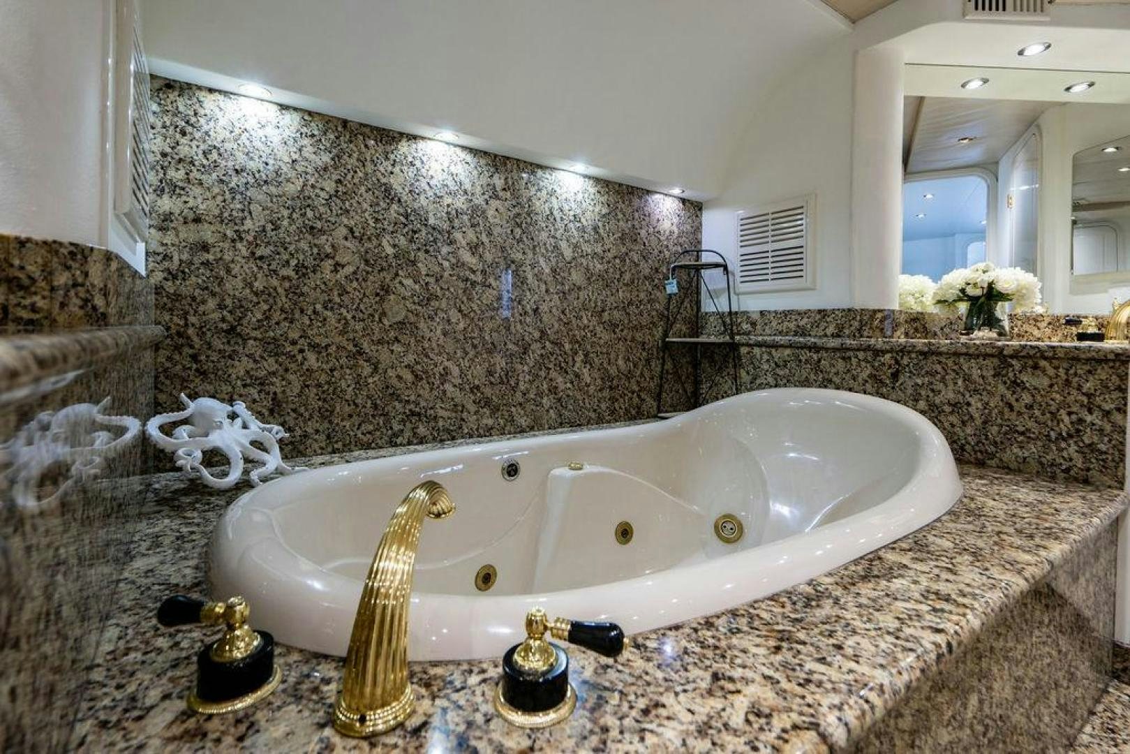 a bathroom with marble tiles aboard THREE BLESSINGS Yacht for Sale