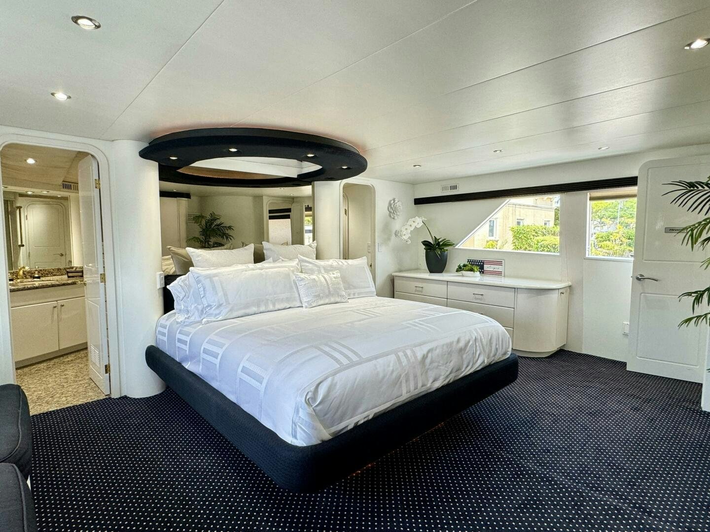 a large bedroom with a large bed aboard THREE BLESSINGS Yacht for Sale