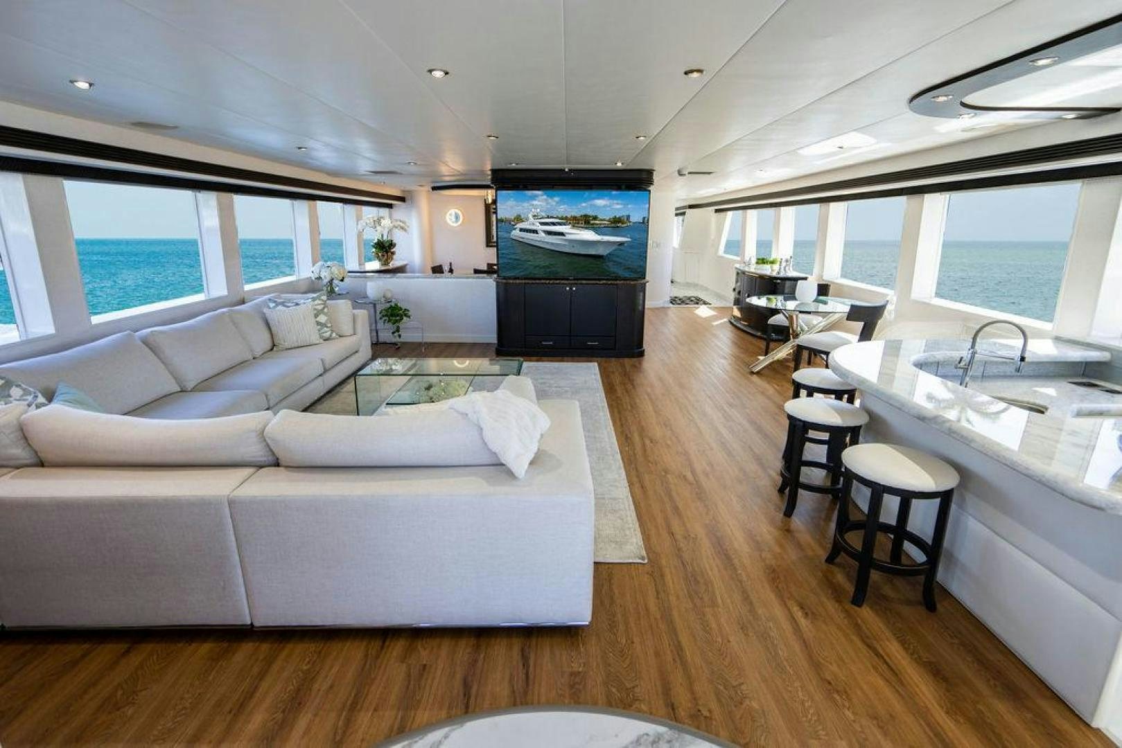 a living room with a couch and a table aboard THREE BLESSINGS Yacht for Sale