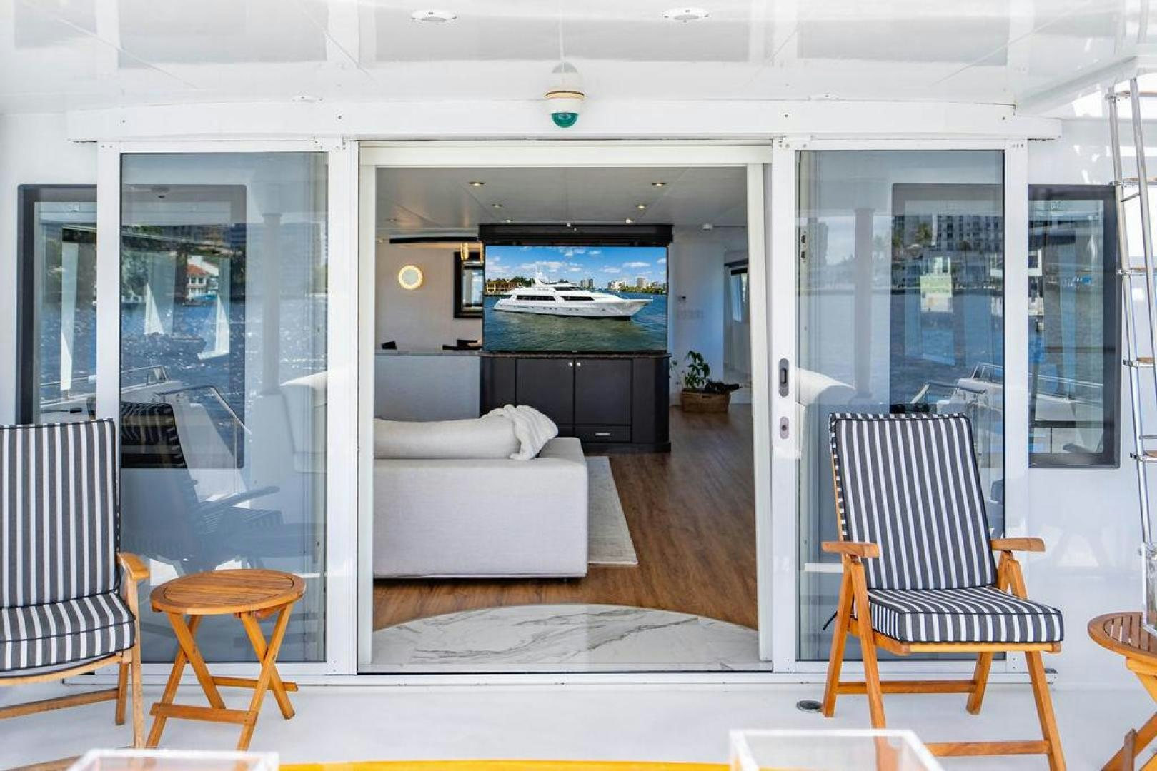 a living room with a couch and a table aboard THREE BLESSINGS Yacht for Sale