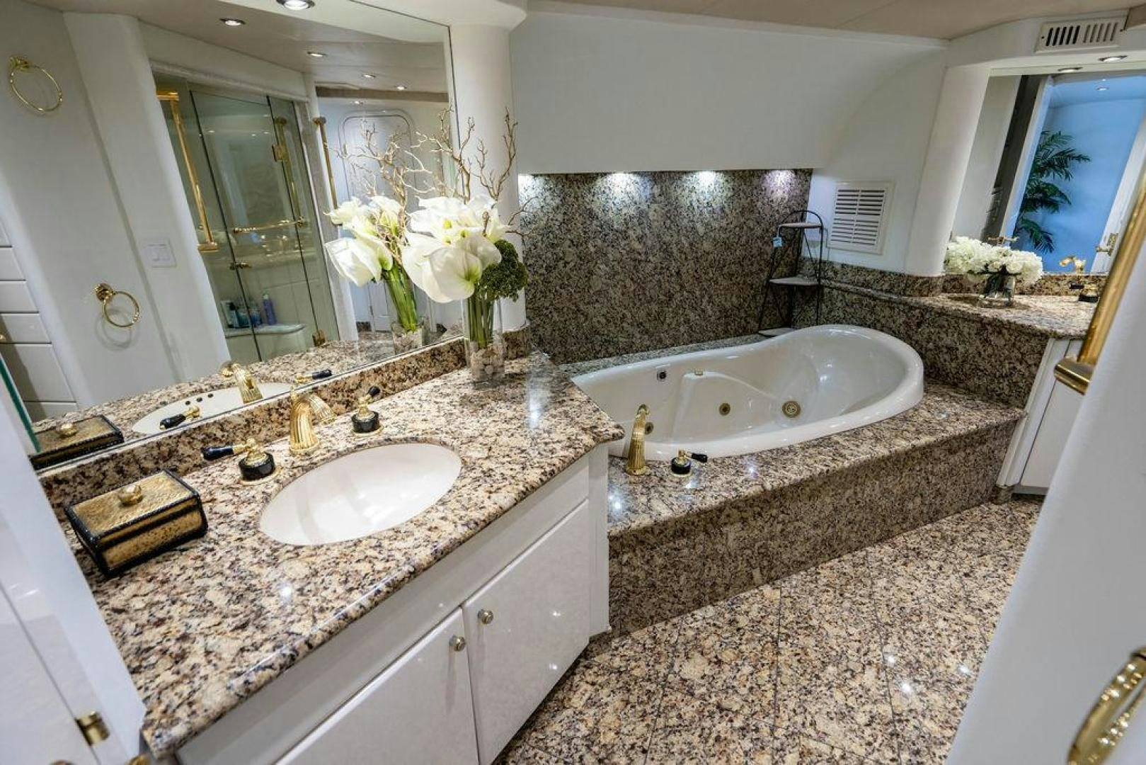 a bathroom with a large marble countertop aboard THREE BLESSINGS Yacht for Sale