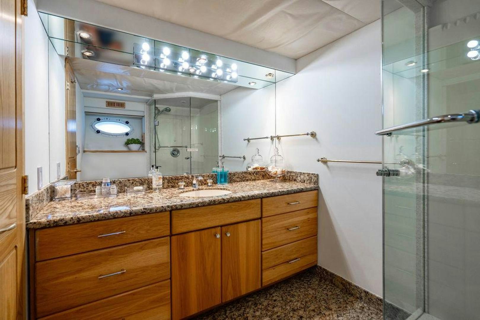 a bathroom with a glass shower aboard THREE BLESSINGS Yacht for Sale