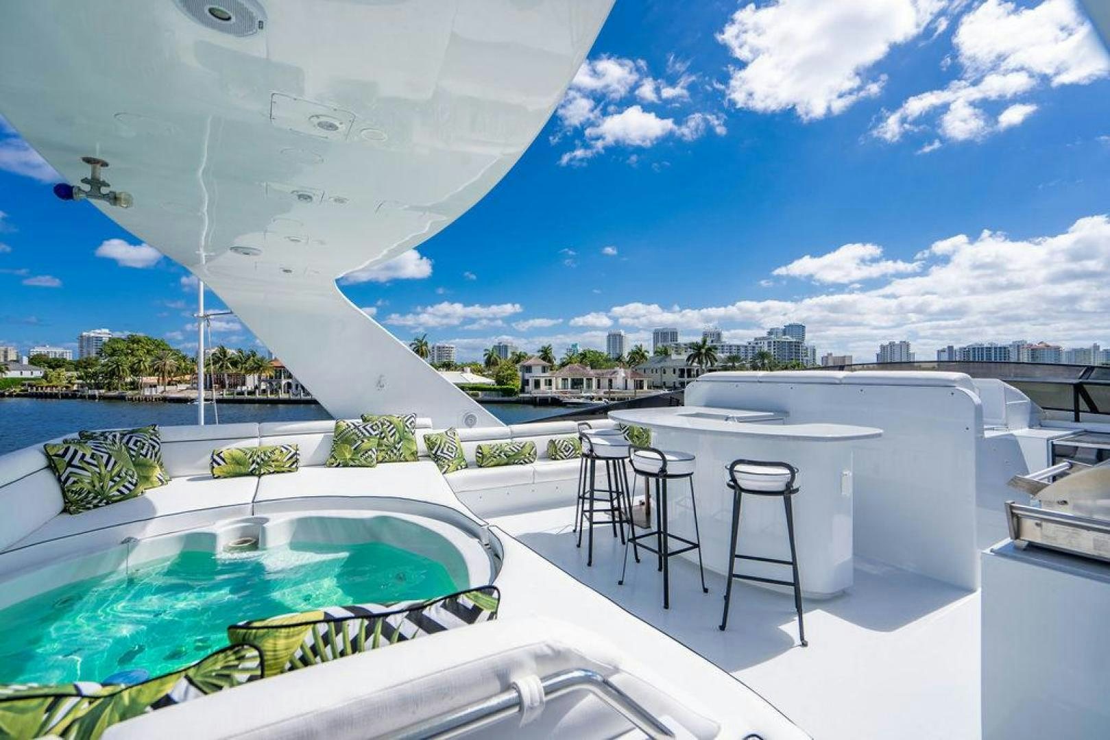 a large white building with a pool aboard THREE BLESSINGS Yacht for Sale