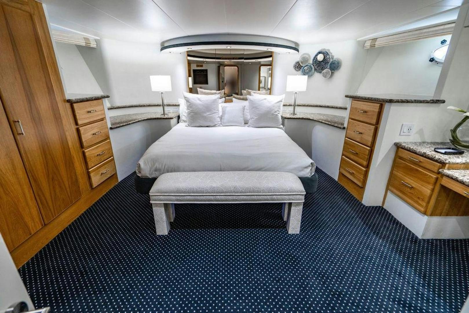 a room with a bed and a desk aboard THREE BLESSINGS Yacht for Sale