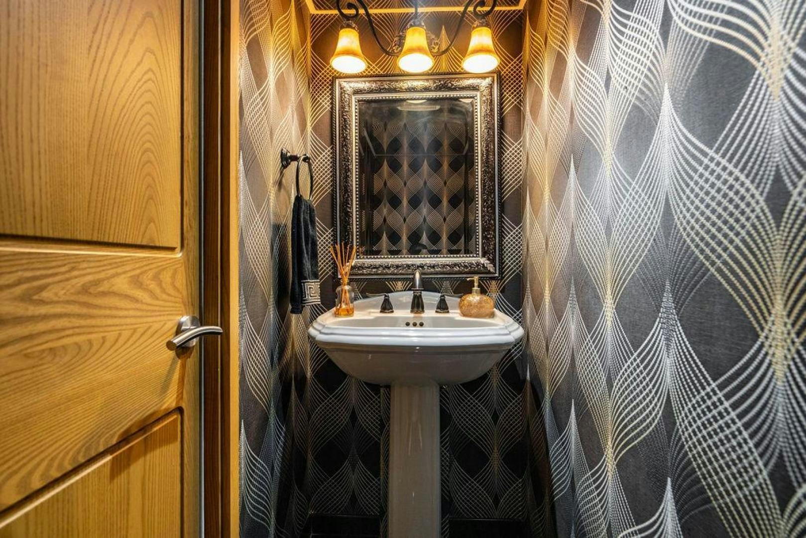a bathroom with a sink and mirror aboard THREE BLESSINGS Yacht for Sale