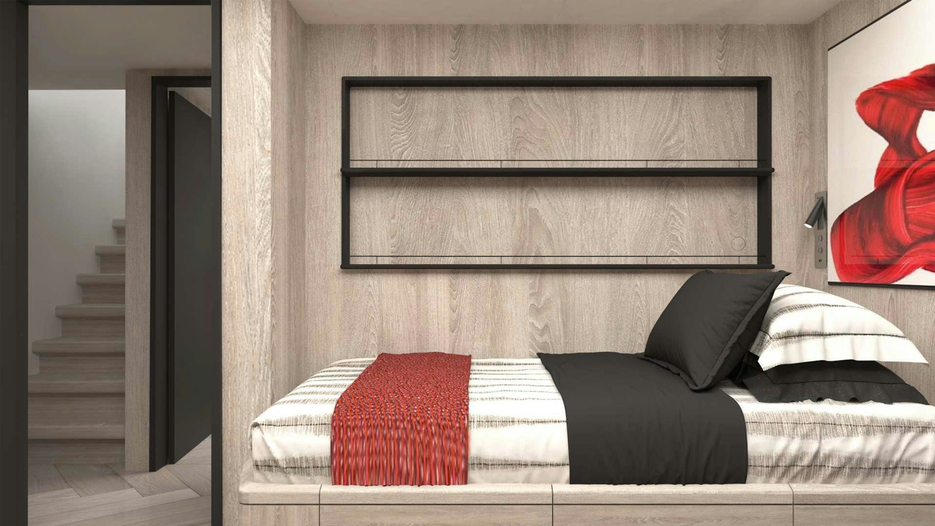 a bed with red pillows aboard EVADNE ROCK XL HULL 1 Yacht for Sale