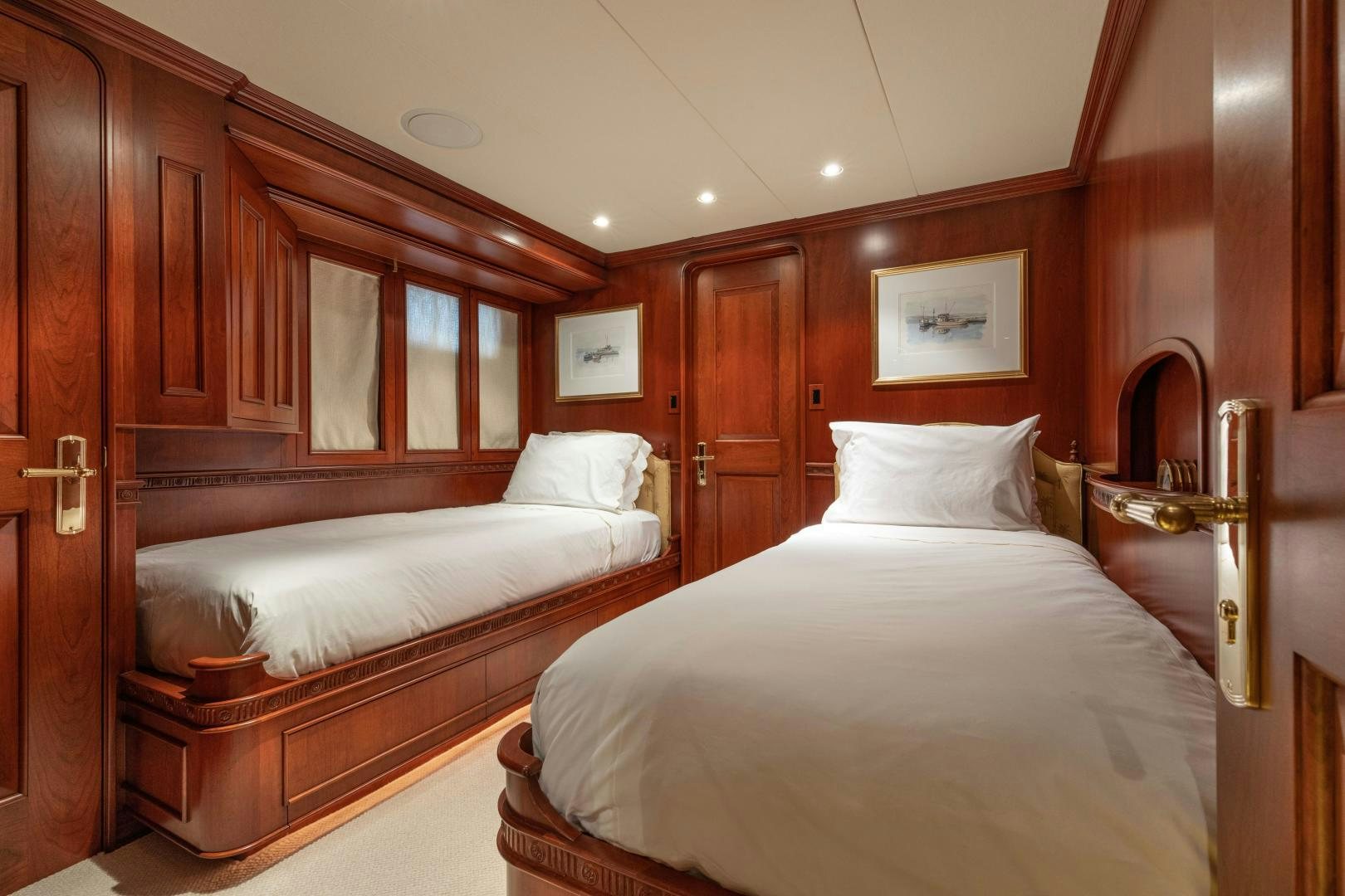 a room with a couple of beds aboard SIMARON Yacht for Sale