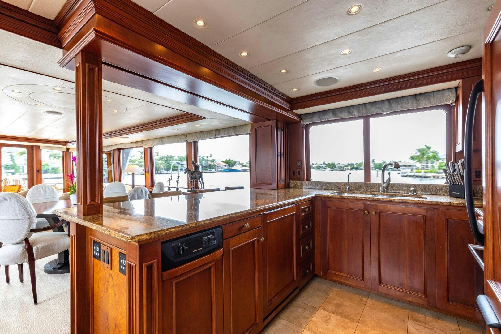 a kitchen with wooden cabinets aboard SIMARON Yacht for Sale