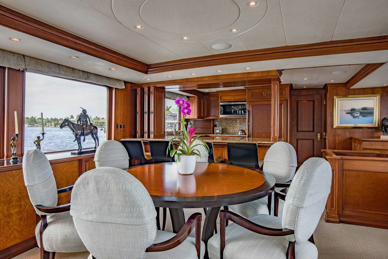 a dining room with a table and chairs aboard SIMARON Yacht for Sale