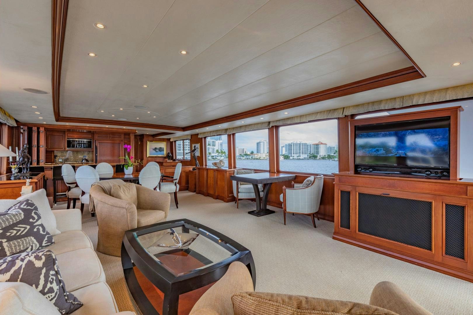 a living room with a tv and furniture aboard SIMARON Yacht for Sale