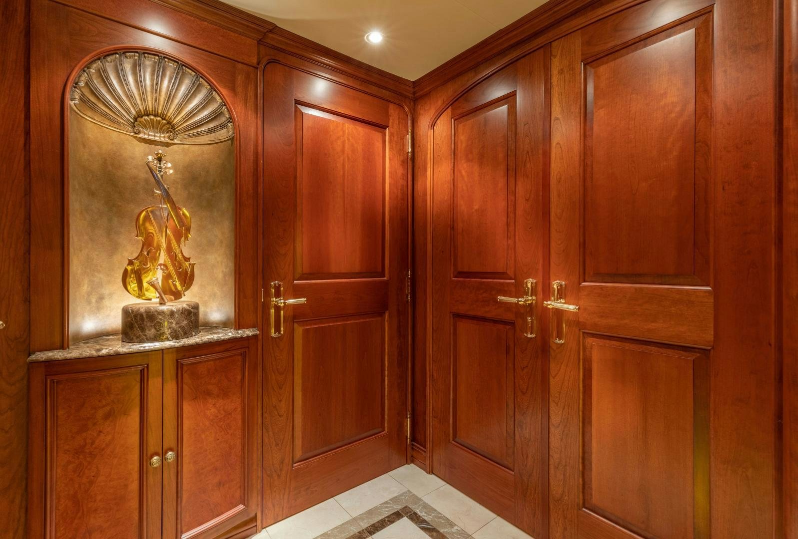 a room with wooden cabinets aboard SIMARON Yacht for Sale