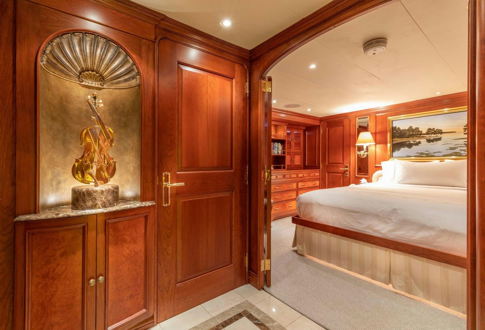 a large room with a bed and a large mirror aboard SIMARON Yacht for Sale