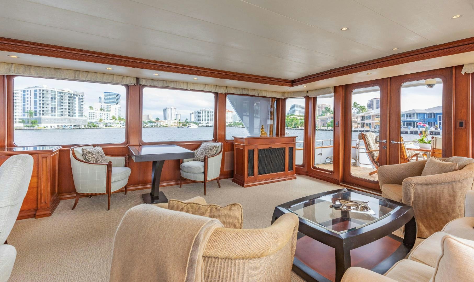 a living room with a table and chairs aboard SIMARON Yacht for Sale