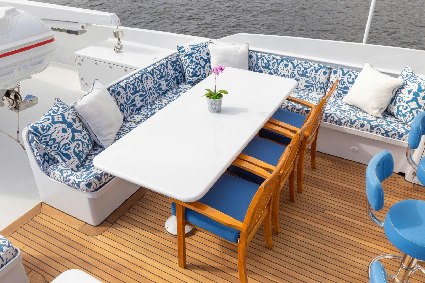 a table with chairs and a couch aboard SIMARON Yacht for Sale