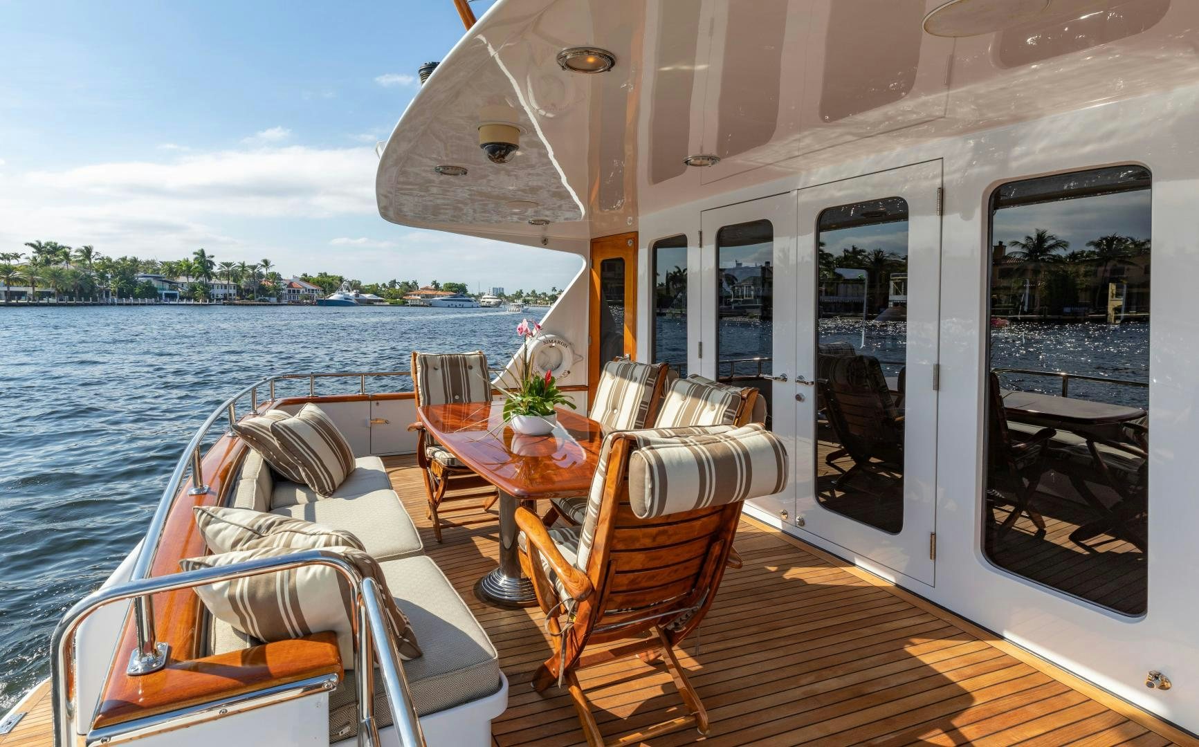 a boat with chairs and tables on a boat aboard SIMARON Yacht for Sale