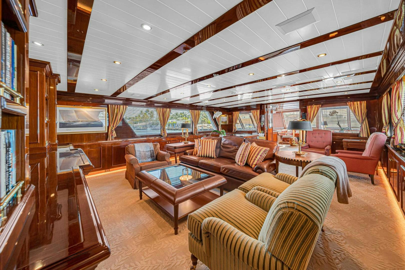 a living room with a wood ceiling aboard INEVITABLE Yacht for Sale