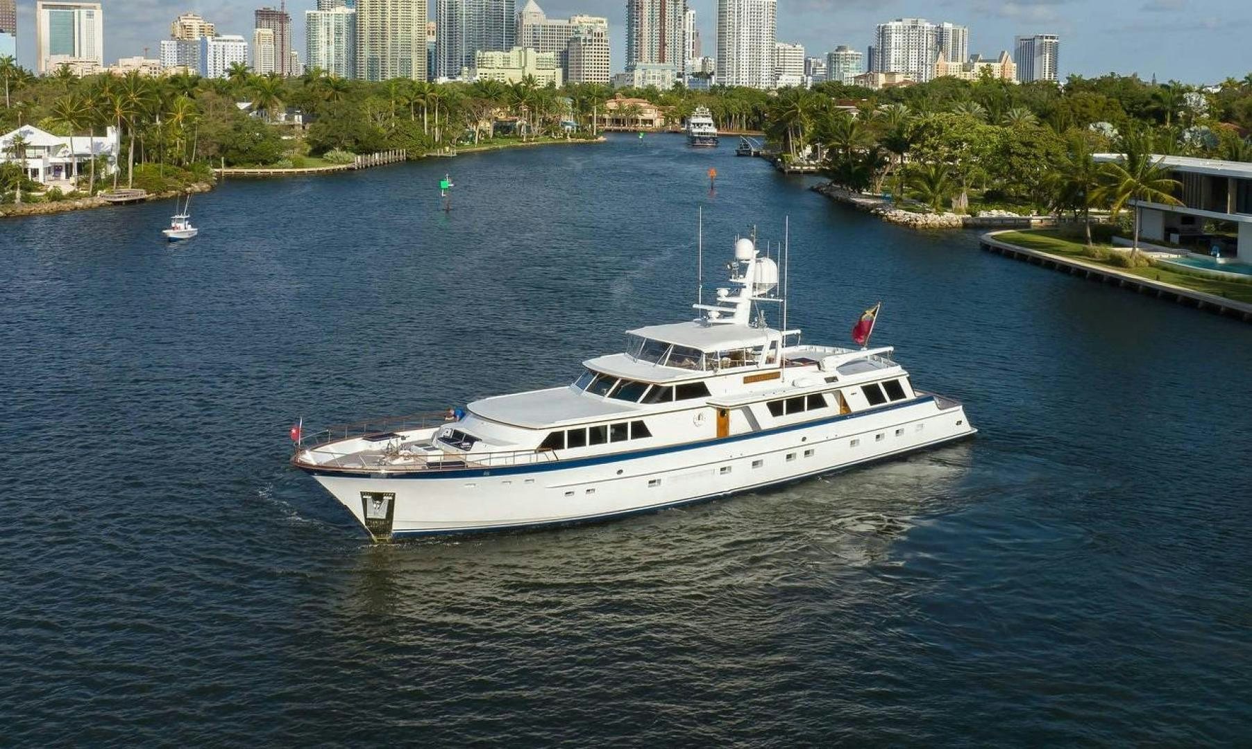a white boat on the water aboard INEVITABLE Yacht for Sale