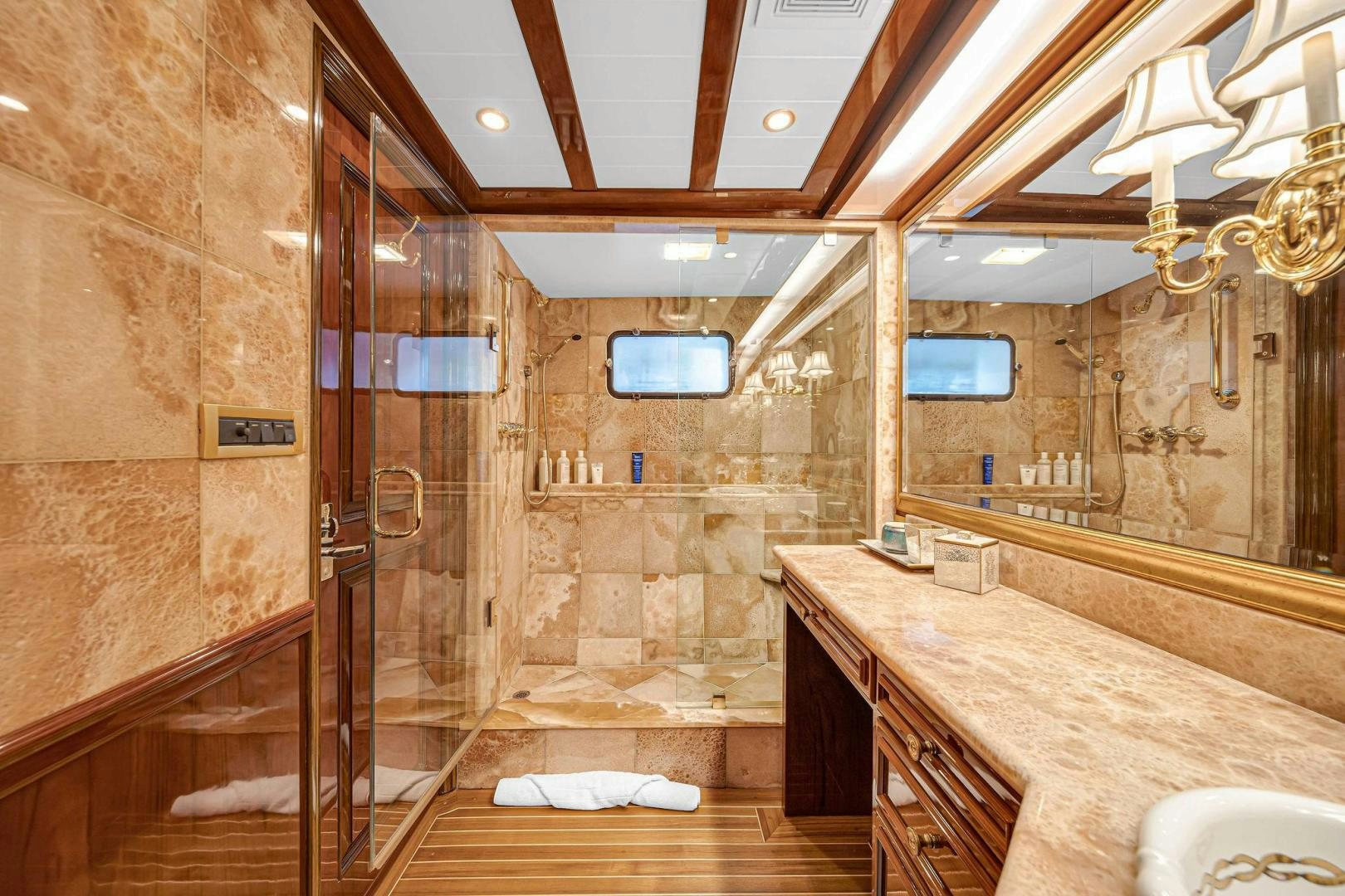 a bathroom with marble counter tops aboard INEVITABLE Yacht for Sale
