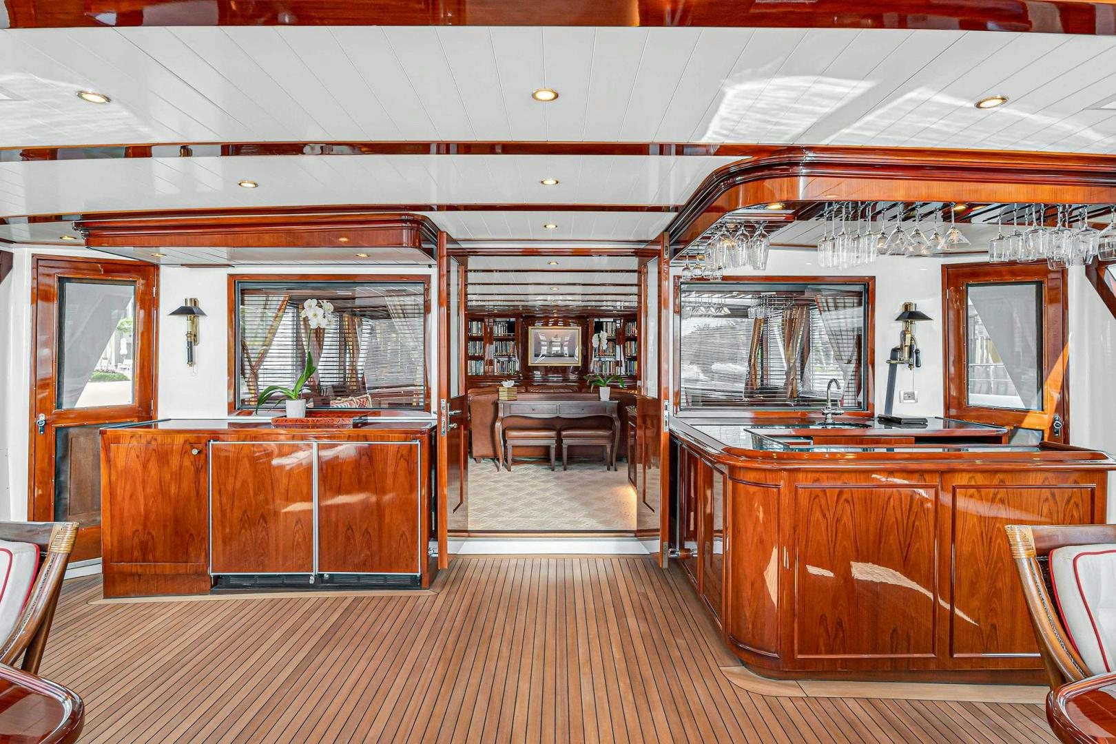 a large wooden room with a wood floor and a wood cabinet aboard INEVITABLE Yacht for Sale