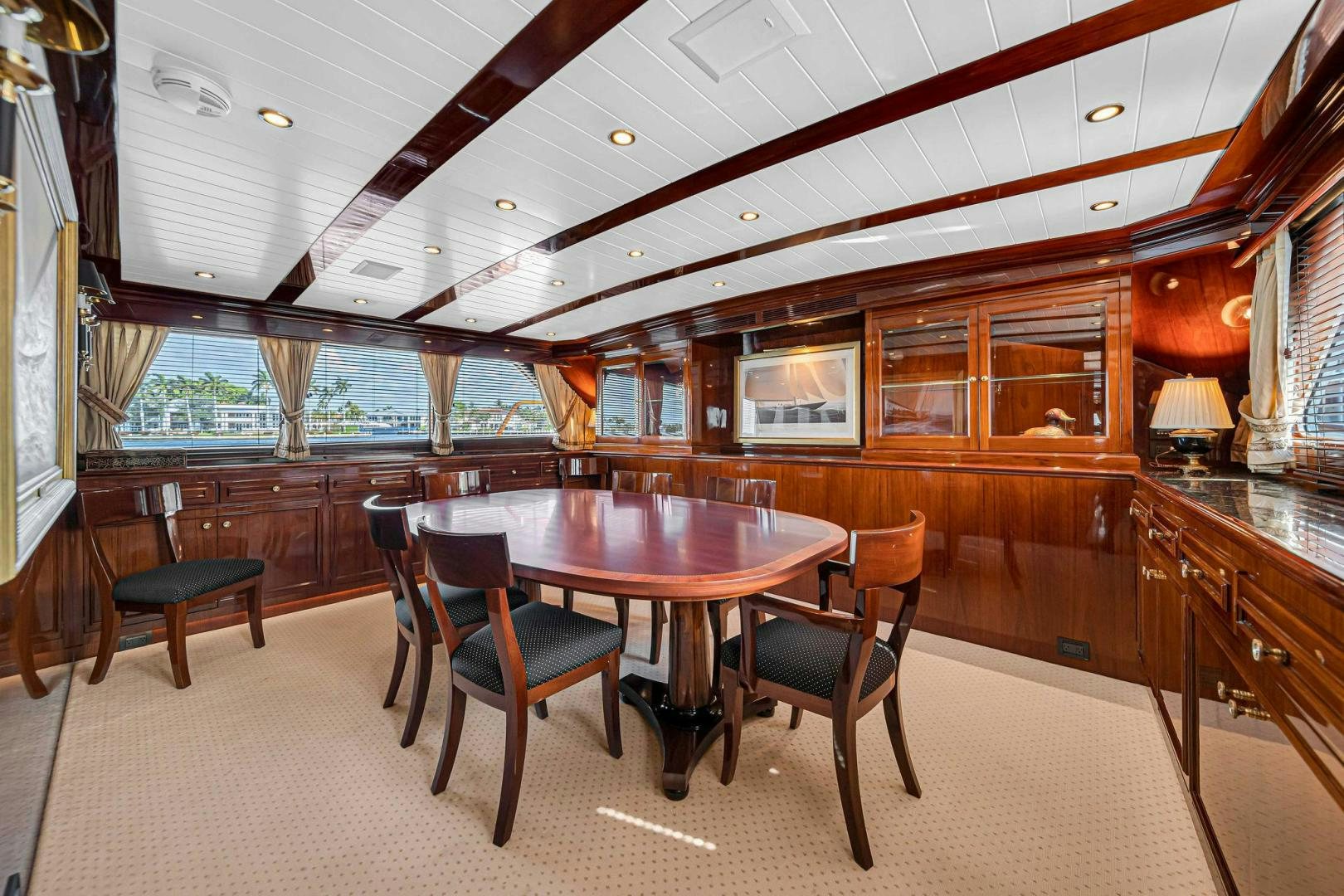 a large kitchen with a table and chairs aboard INEVITABLE Yacht for Sale