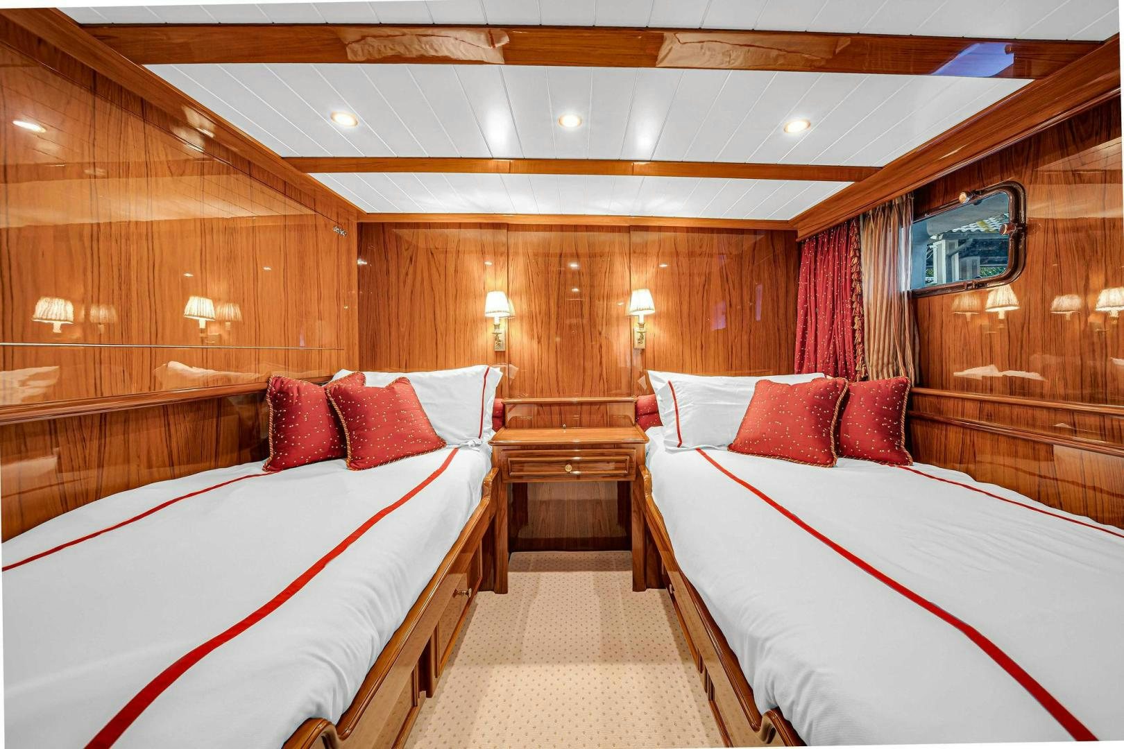 a room with a couple of beds aboard INEVITABLE Yacht for Sale