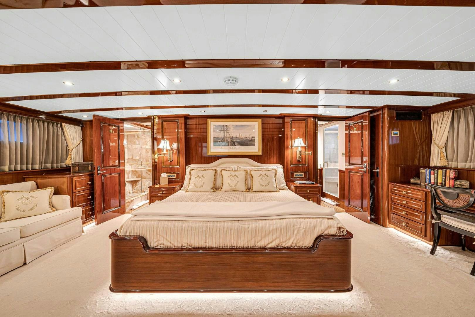a large bedroom with a large bed aboard INEVITABLE Yacht for Sale